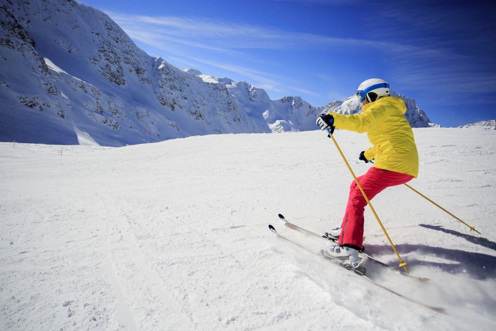 Skiing, skier, winter sport - woman skiing downhill