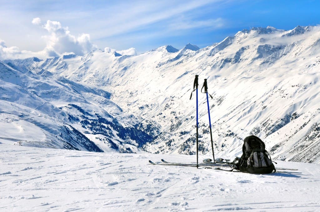 Skis, Ski Poles And Backpack In Alps