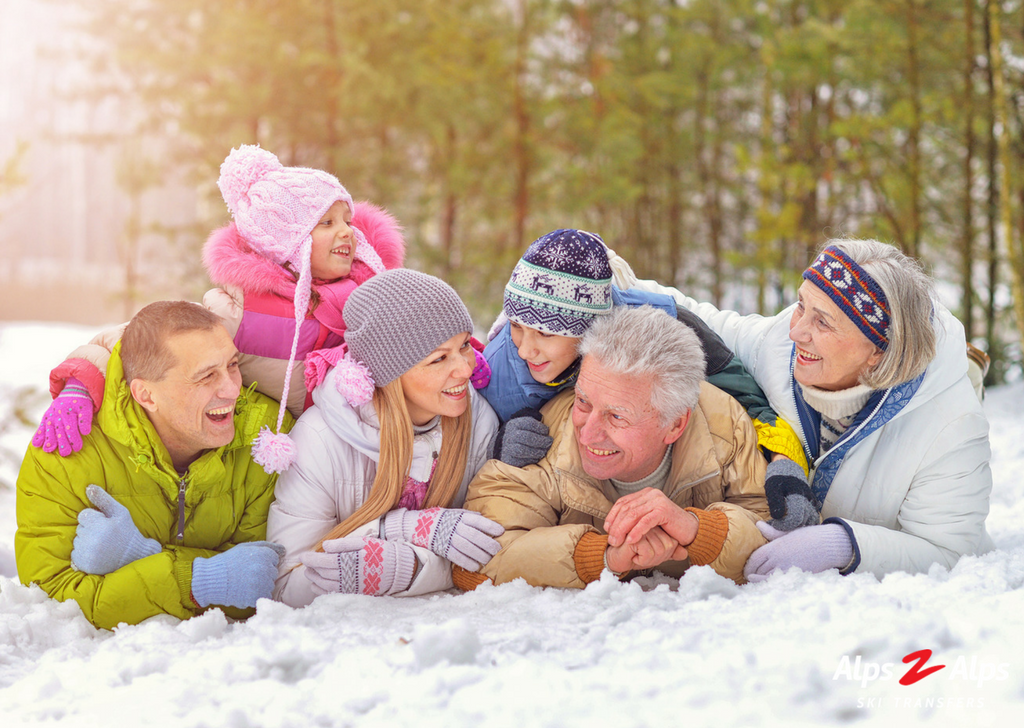 Family laying in snow