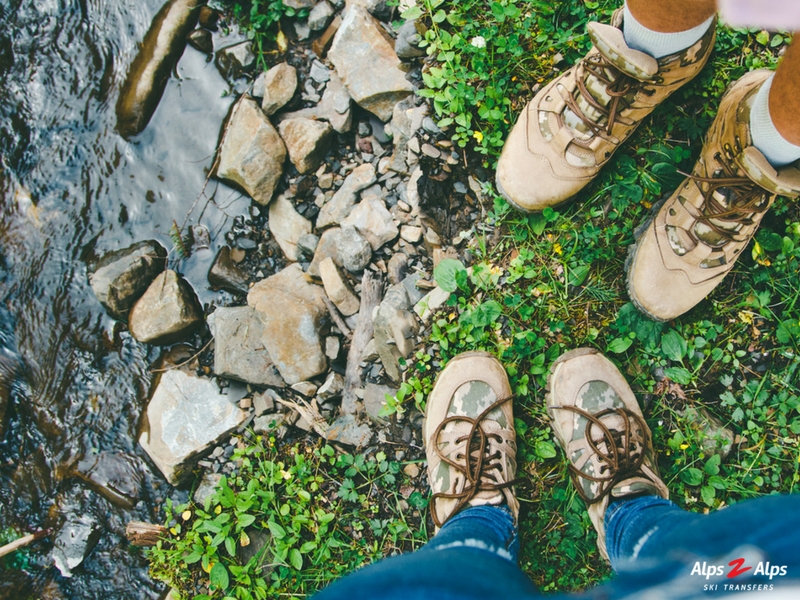 Hiking boots in the Alps in summer
