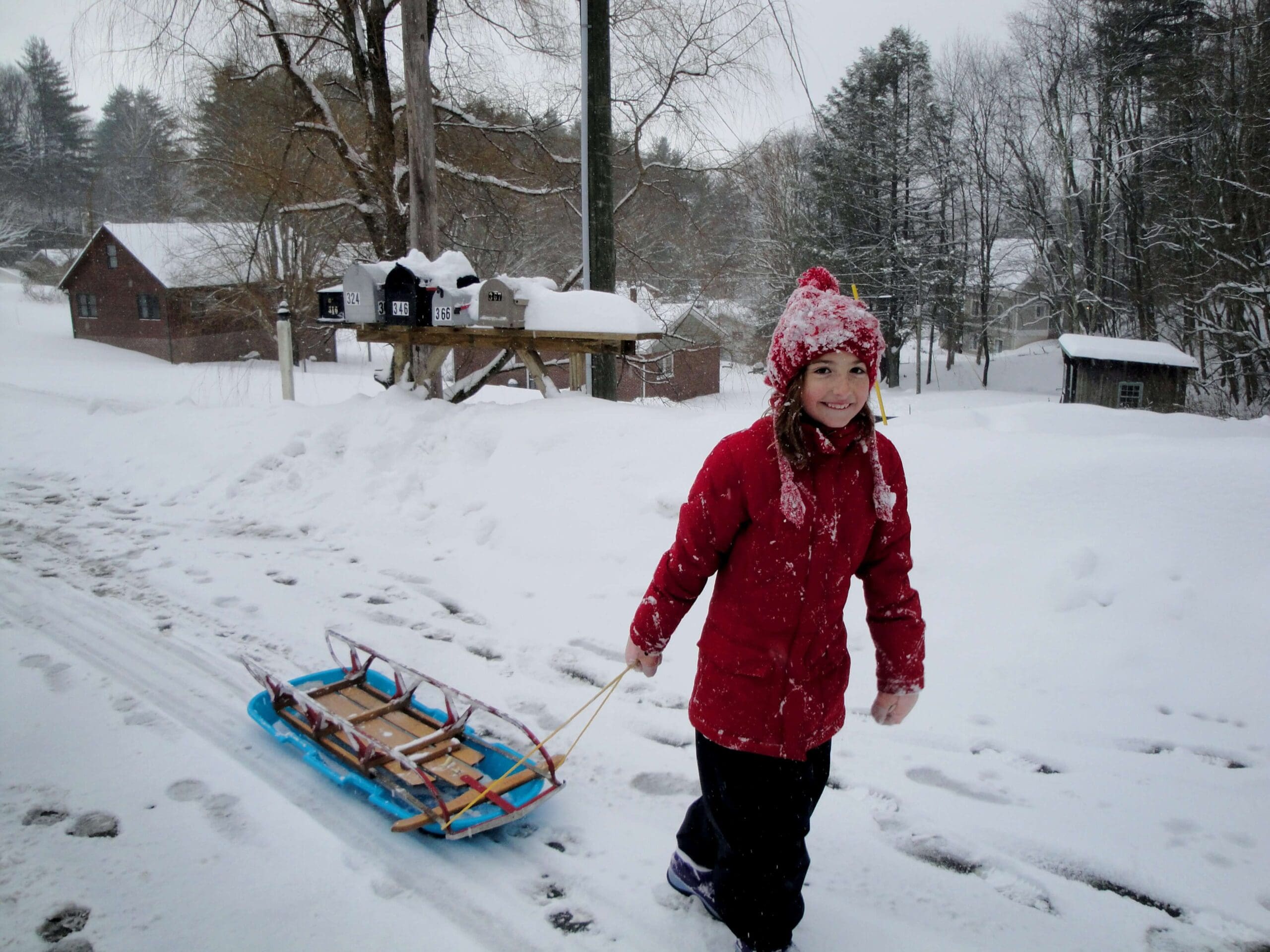 Girl pulling a sled