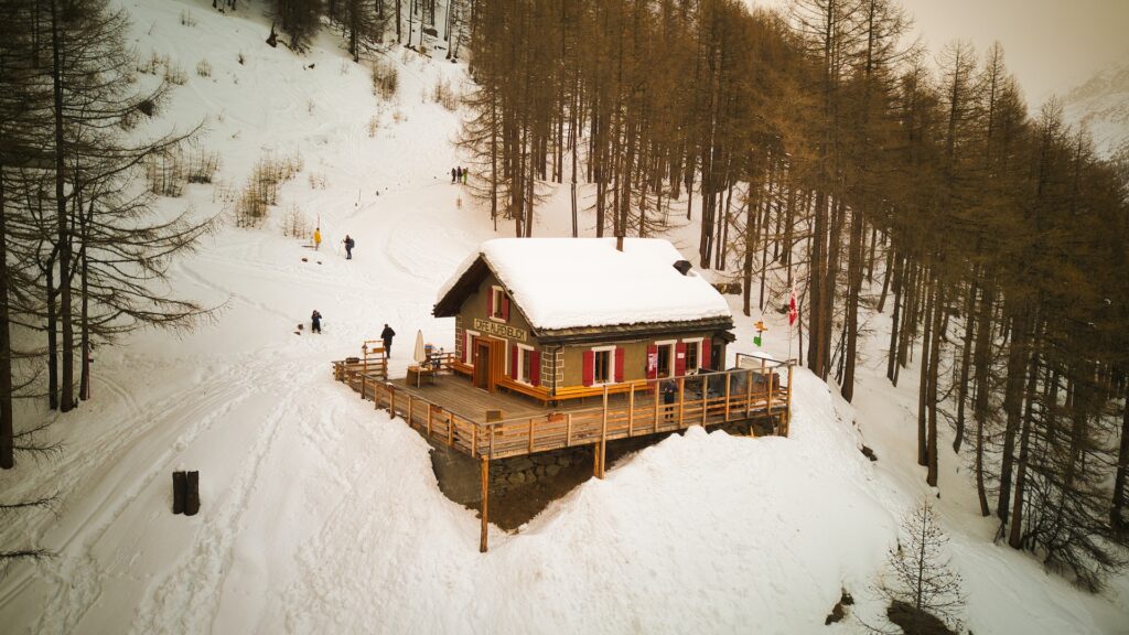 Snowy cafe at the foot of ski slope in Saas Fee ski resort